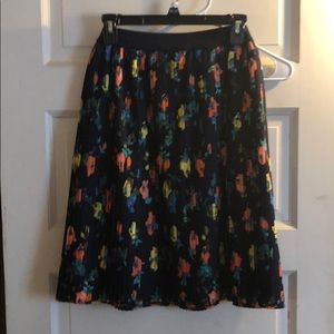 Navy pleated skirt with floral pattern